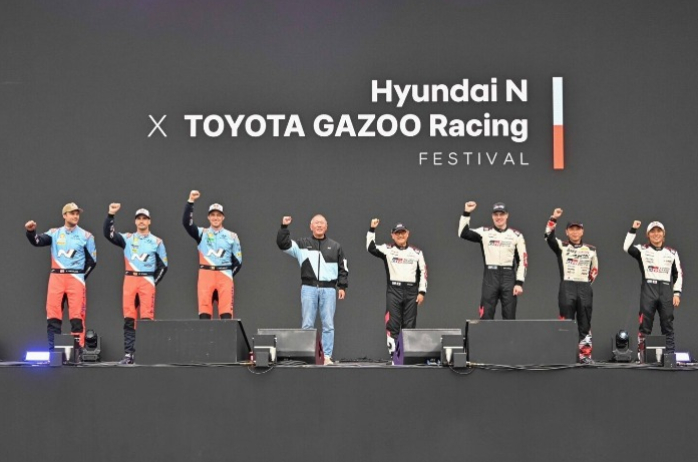 Hyundai Motor Group Executive Chair Chung Euisun (4th from left) and Toyota Motor Chairman Akio Toyoda (4th from right) pose for a group photo during the Hyundai N x TOYOTA GAZOO Racing Festival at Yongin Speedway in S.Korea on Oct. 27, 2024 (Image: Courtesy of Hyundai Motor)