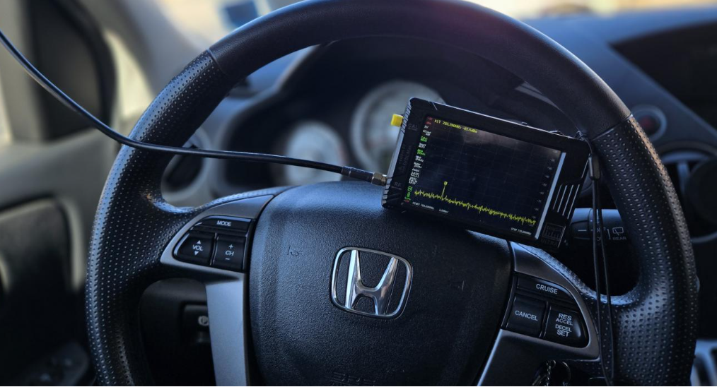 tinySA spectrum analyzer installed in a vehicle, detecting presence of a hidden GPS tracker. Photo credit Mo Satt